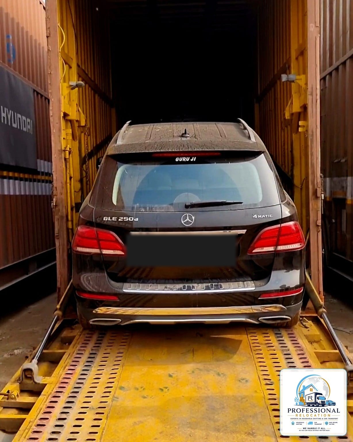 Mercedes-Benz GLE 250d being loaded onto a covered car carrier